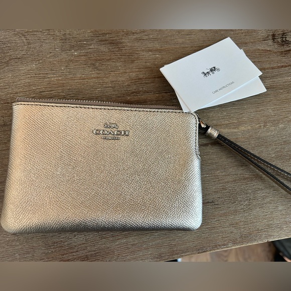 Coach Handbags - Coach Corner Zip Wristlet Gold new